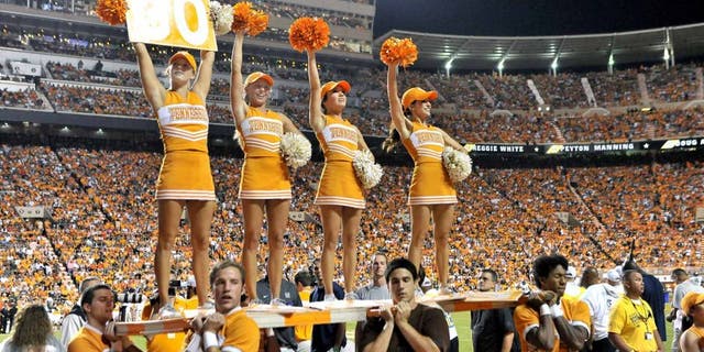 Aug 31, 2014; Knoxville, TN, USA; Tennessee Volunteers cheerleaders entertain fans during the first half against the Utah State Aggies at Neyland Stadium. Mandatory Credit: Jim Brown-USA TODAY Sports