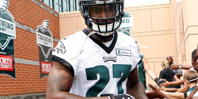 Jul 26, 2014; Philadelphia, PA, USA; Philadelphia Eagles free safety Malcolm Jenkins (27) is greeted by fans as he runs onto the field for the start of training camp at the Novacare Complex. Mandatory Credit: Bill Streicher-USA TODAY Sports