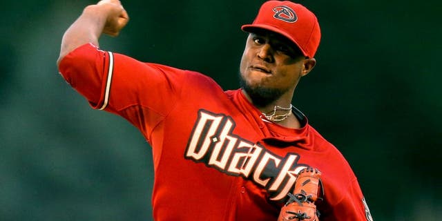 DENVER, CO - SEPTEMBER 1: Starting pitcher Rubby De La Rosa #12 of the Arizona Diamondbacks delivers to home plate during the first inning against the Colorado Rockies at Coors Field on September 1, 2015 in Denver, Colorado. (Photo by Justin Edmonds/Getty Images)