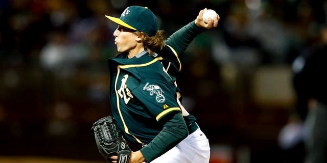 OAKLAND, CA - SEPTEMBER 01: Ryan Dull #66 of the Oakland Athletics pitches against the Los Angeles Angels of Anaheim in the eighth inning at O.co Coliseum on September 1, 2015 in Oakland, California. This was his Major League debut. (Photo by Ezra Shaw/Getty Images)