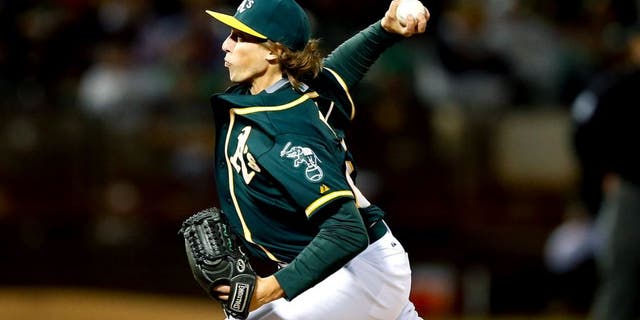 OAKLAND, CA - SEPTEMBER 01: Ryan Dull #66 of the Oakland Athletics pitches against the Los Angeles Angels of Anaheim in the eighth inning at O.co Coliseum on September 1, 2015 in Oakland, California. This was his Major League debut. (Photo by Ezra Shaw/Getty Images)