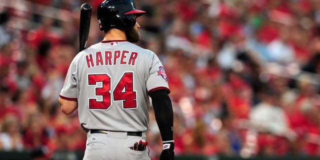 Sep 2, 2015; St. Louis, MO, USA; Washington Nationals right fielder Bryce Harper (34) walks back to the dugout after striking out during the first inning against the St. Louis Cardinals at Busch Stadium. The Nationals defeated the Cardinals 4-3. Mandatory Credit: Jeff Curry-USA TODAY Sports