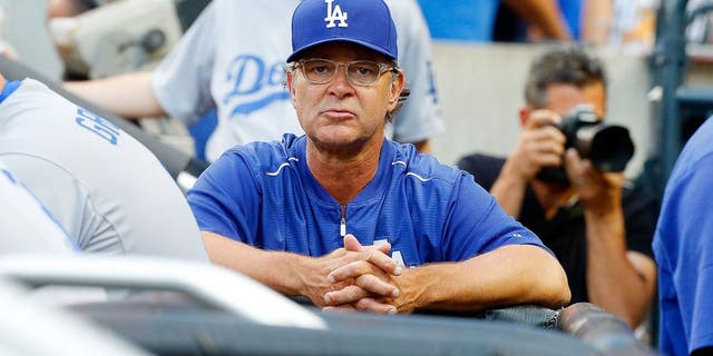 NEW YORK, NY - JULY 24: (NEW YORK DAILIES OUT) Manager Don Mattingly #8 of the Los Angeles Dodgers looks on against the New York Mets at Citi Field on July 24, 2015 in the Flushing neighborhood of the Queens borough of New York City. The Dodgers defeated the Mets 7-2. (Photo by Jim McIsaac/Getty Images)