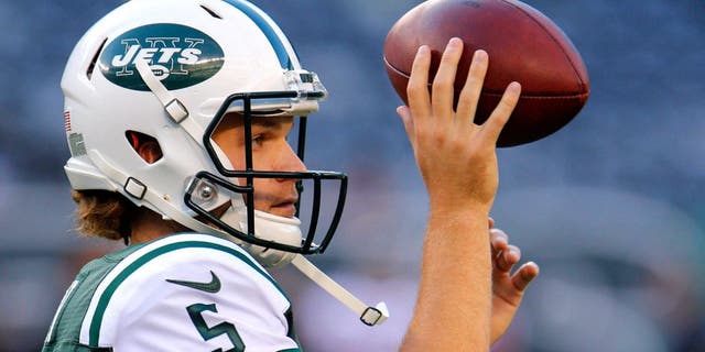 Aug 21, 2015; East Rutherford, NJ, USA; New York Jets quarterback Matt Flynn (5) during warm up before game against the Atlanta Falcons at MetLife Stadium. Mandatory Credit: Noah K. Murray-USA TODAY Sports