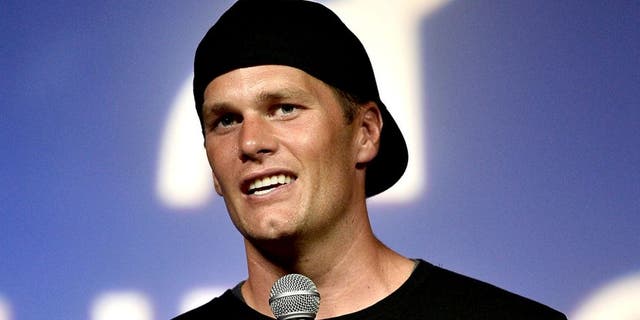ALLSTON, MA - MAY 29: NFL player and Best Buddies honorary co-chair Tom Brady speaks on stage during a Guy Fieri celebrity chef tailgate for the Best Buddies Challenge: Hyannis Port 2015 at Harvard Field on May 29, 2015 in Allston, Massachusetts. (Photo by Paul Marotta/Getty Images for Best Buddies)