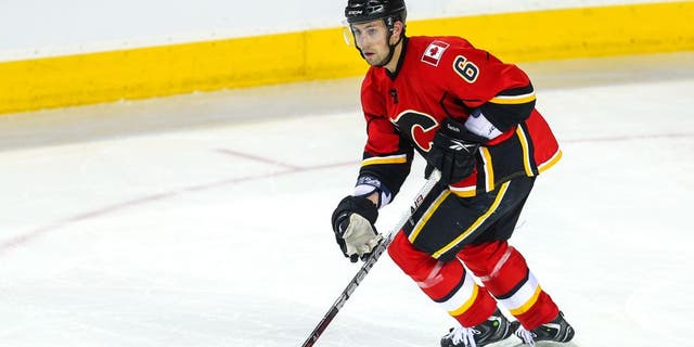Apr 12, 2013; Calgary, Alberta, CAN; Calgary Flames defenseman Cory Sarich (6) skates with the puck against the Phoenix Coyotes during the third period at the Scotiabank Saddledome. Calgary Flames won 3-2. Mandatory Credit: Sergei Belski-USA TODAY Sports