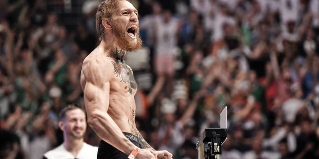 LAS VEGAS, NV - JULY 10: UFC featherweight Conor 'The Notorious' McGregor of Ireland interacts with the crowd during the UFC 189 weigh-in at the MGM Grand Garden Arena on July 10, 2015 in Las Vegas, Nevada. (Photo by Jeff Bottari/Zuffa LLC/Zuffa LLC via Getty Images)