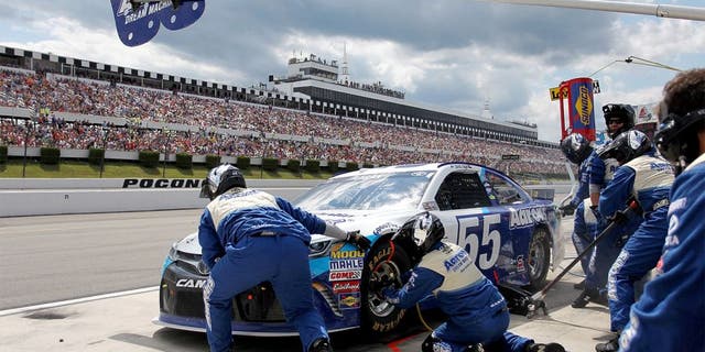 LONG POND, PA - AUGUST 02: David Ragan, driver of the #55 Aaron's Dream Machine Toyota, pits during the NASCAR Sprint Cup Series Windows 10 400 at Pocono Raceway on August 2, 2015 in Long Pond, Pennsylvania. (Photo by Tim Bradbury/Getty Images)