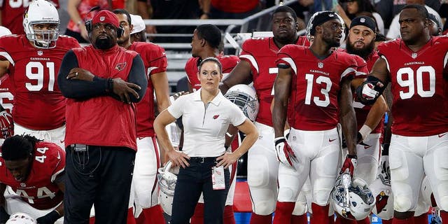GLENDALE, AZ - AUGUST 15: Intern linebacker coach Jen Welter (C) of the Arizona Cardinals watches from the sidelines during the pre-season NFL game against the Kansas City Chiefs at the University of Phoenix Stadium on August 15, 2015 in Glendale, Arizona. The Chiefs defeated the Cardinals 34-19. (Photo by Christian Petersen/Getty Images)