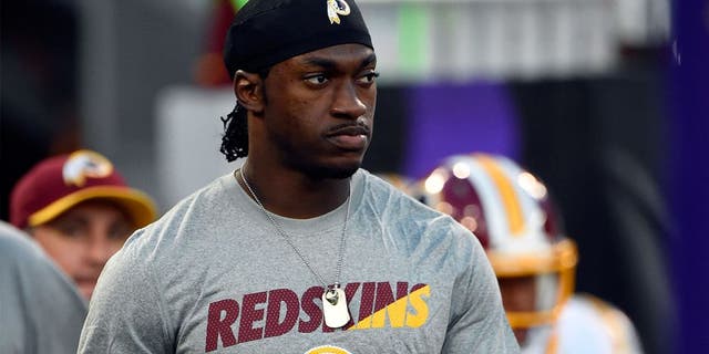 Aug 29, 2015; Baltimore, MD, USA; Washington Redskins quarterback Robert Griffin III (10) walks on to the field with his teammates before the game against the Baltimore Ravens at M&T Bank Stadium. Mandatory Credit: Tommy Gilligan-USA TODAY Sports