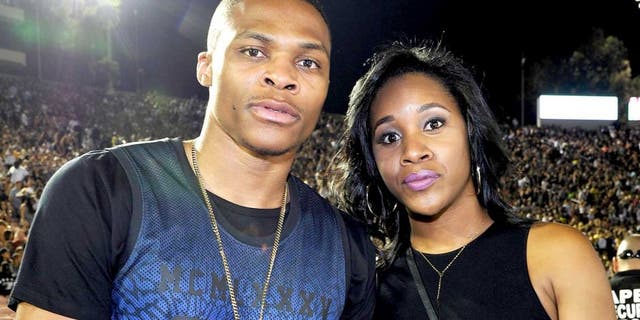 PASADENA, CA - AUGUST 02: (L-R) Russell Westbrook and Nina Earl attend D'USSE VIP riser and lounge at "On The Run Tour" at Rose Bowl on August 2, 2014 in Pasadena, California. (Photo by John Sciulli/Getty Images for D'USSE)