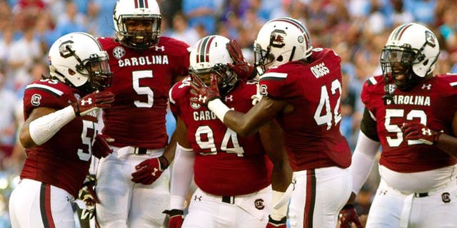 Sep 3, 2015; Charlotte, NC, USA; South Carolina Gamecocks defensive tackle Kelsey Griffin (94) celebrates with teammates during the second quarter against the North Carolina Tar Heels at Bank of America Stadium. Mandatory Credit: Joshua S. Kelly-USA TODAY Sports