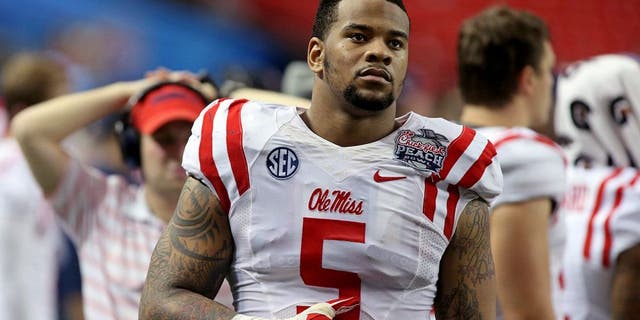 Dec 31, 2014; Atlanta , GA, USA; Mississippi Rebels defensive tackle Robert Nkemdiche (5) reacts to a teammate's injury during the second quarter against the TCU Horned Frogs in the 2014 Peach Bowl at the Georgia Dome. The Horned Frogs won 42-3. Mandatory Credit: Jason Getz-USA TODAY Sports
