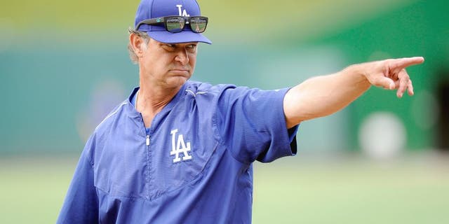 WASHINGTON, DC - JULY 17: Manager Don Mattingly #8 of the Los Angeles Dodgers watches batting practice before the game against the Washington Nationals at Nationals Park on July 17, 2015 in Washington, DC. (Photo by G Fiume/Getty Images)