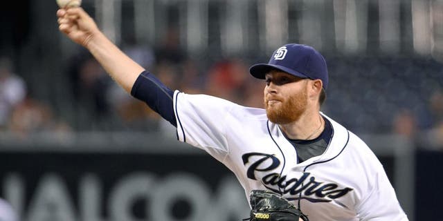 SAN DIEGO, CA - SEPTEMBER 2: Ian Kennedy #22 of the San Diego Padres pitches during the first inning of a baseball game against the Texas Rangers at Petco Park September, 2, 2015 in San Diego, California. (Photo by Denis Poroy/Getty Images)