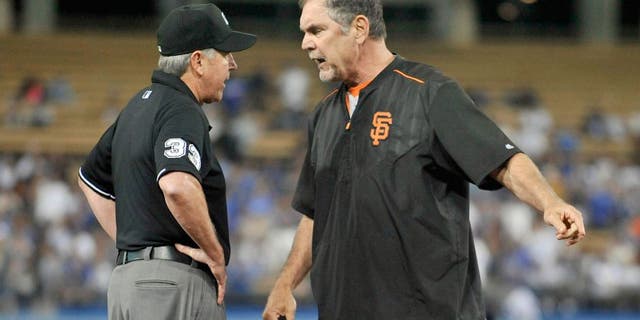 September 2, 2015; Los Angeles, CA, USA; San Francisco Giants manager Bruce Bochy (15) argues a call with umpire Mike Winters in the eighth inning at Dodger Stadium. Mandatory Credit: Gary A. Vasquez-USA TODAY Sports