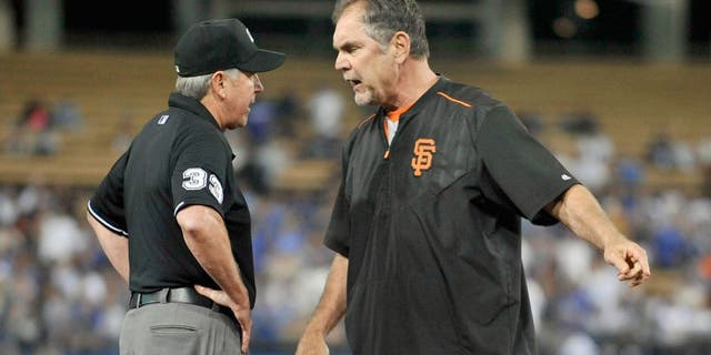 September 2, 2015; Los Angeles, CA, USA; San Francisco Giants manager Bruce Bochy (15) argues a call with umpire Mike Winters in the eighth inning at Dodger Stadium. Mandatory Credit: Gary A. Vasquez-USA TODAY Sports