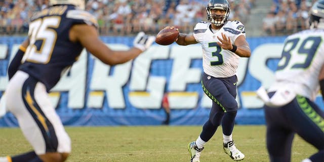 Aug 29, 2015; San Diego, CA, USA; Seattle Seahawks quarterback Russell Wilson (3) looks to pass during the third quarter against the San Diego Chargers at Qualcomm Stadium. Mandatory Credit: Jake Roth-USA TODAY Sports