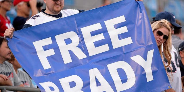 CHARLOTTE, NC - AUGUST 28: Fans hold up a sign in support of Tom Brady #12 of the New England Patriots during their preseason NFL game against the Carolina Panthers at Bank of America Stadium on August 28, 2015 in Charlotte, North Carolina. (Photo by Grant Halverson/Getty Images)