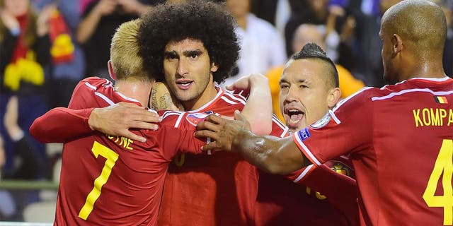 Belgium's Marouane Fellaini (2ndL) celebrates after scoring during the Euro 2016 qualifying match between Belgium and Bosnia and Herzegovina at the King Baudouin Stadium in Brussels, on September 3, 2015. AFP PHOTO / EMMANUEL DUNAND (Photo credit should read EMMANUEL DUNAND/AFP/Getty Images)