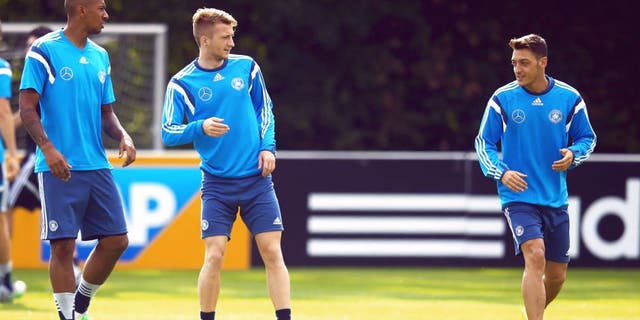 FRANKFURT AM MAIN, GERMANY - SEPTEMBER 02: Jerome Boateng, Marco Reus and Mesut Oezil (L-R) attend a Germany training session at 'Kleine Kampfbahn' training ground on September 2, 2015 in Frankfurt am Main, Germany. (Photo by Alex Grimm/Bongarts/Getty Images)