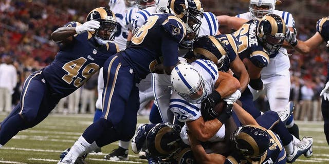 ST. LOUIS, MO - AUGUST 29: Tyler Varga #38 of the Indianapolis Colts scores a touchdown against the St. Louis Rams in the fourth quarter during a preseason game at the Edward Jones Dome on August 29, 2014 in St. Louis, Missouri. (Photo by Dilip Vishwanat/Getty Images)