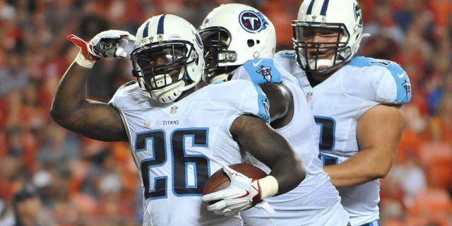 Aug 28, 2015; Kansas City, MO, USA; Tennessee Titans running back Antonio Andrews (26) celebrates after scoring a touchdown against the Kansas City Chiefs during the first half at Arrowhead Stadium. Mandatory Credit: Denny Medley-USA TODAY Sports