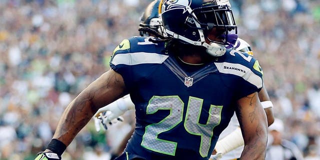 SEATTLE, WA - SEPTEMBER 04: Running back Marshawn Lynch #24 of the Seattle Seahawks scores a touchdown during the second quarter of the game against the Green Bay Packers at CenturyLink Field on September 4, 2014 in Seattle, Washington. (Photo by Otto Greule Jr/Getty Images)