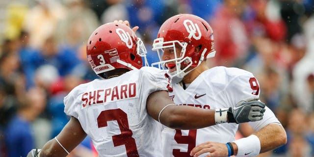 Sep 6, 2014; Tulsa, OK, USA; Oklahoma Sooners wide receiver Sterling Shepard (3) celebrates scoring a touchdown with quarterback Trevor Knight (9) during the second half against the Tulsa Golden Hurricane at Skelly Field at H.A. Chapman Stadium. Mandatory Credit: Kevin Jairaj-USA TODAY Sports