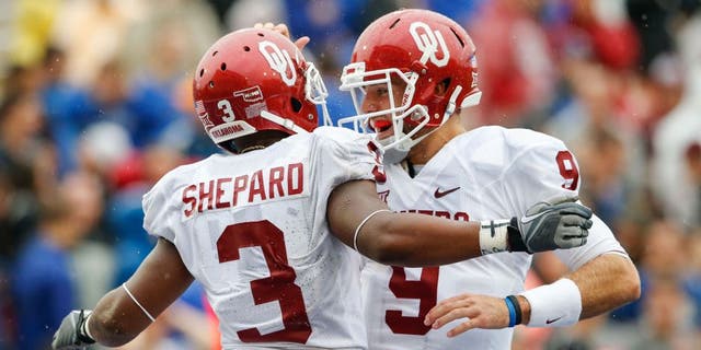 Sep 6, 2014; Tulsa, OK, USA; Oklahoma Sooners wide receiver Sterling Shepard (3) celebrates scoring a touchdown with quarterback Trevor Knight (9) during the second half against the Tulsa Golden Hurricane at Skelly Field at H.A. Chapman Stadium. Mandatory Credit: Kevin Jairaj-USA TODAY Sports