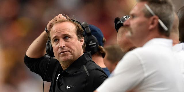 Aug 30, 2014; Atlanta, GA, USA; West Virginia Mountaineers head coach Dana Holgorsen watches his team against the Alabama Crimson Tide in the second quarter of the 2014 Chick-fil-A Kickoff Game at the Georgia Dome. Mandatory Credit: RVR Photos-USA TODAY Sports