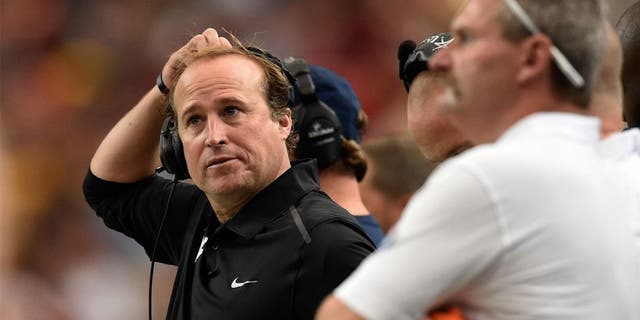 Aug 30, 2014; Atlanta, GA, USA; West Virginia Mountaineers head coach Dana Holgorsen watches his team against the Alabama Crimson Tide in the second quarter of the 2014 Chick-fil-A Kickoff Game at the Georgia Dome. Mandatory Credit: RVR Photos-USA TODAY Sports
