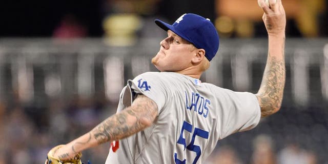 SAN DIEGO, CA - SEPTEMBER 3: Mat Latos #55 of the Los Angeles Dodgers pitches during the first inning of a baseball game against the San Diego Padres at Petco Park September, 3, 2015 in San Diego, California. (Photo by Denis Poroy/Getty Images)