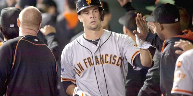 DENVER, CO - SEPTEMBER 3: Ryan Vogelsong #32 of the San Francisco Giants in the dugout after hitting his first career home run in the fourth inning of a game at Coors Field on September 3, 2015 in Denver, Colorado. (Photo by Dustin Bradford/Getty Images)