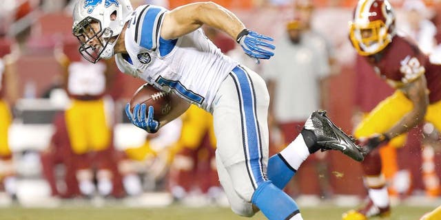 Aug 20, 2015; Landover, MD, USA; Detroit Lions running back Zach Zenner (41) carries the ball against the Washington Redskins at FedEx Field. Mandatory Credit: Geoff Burke-USA TODAY Sports