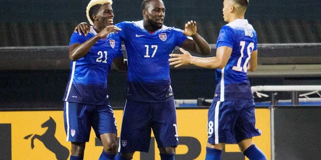 U.S. forward Jozy Altidore (17) celebrates his second goal with teammates forwards Gyasi Zardes (21) and Bobby Wood (18) during the second half of an international friendly soccer match against Peru, Friday, Sept. 4, 2015 at RFK Stadium in Washington. (AP Photo/Pablo Martinez Monsivais)