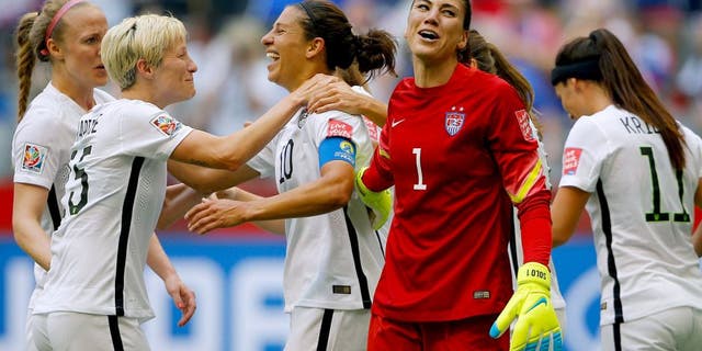VANCOUVER, BC - JULY 05: Carli Lloyd #10 of the United States of America celebrates after her third goal against Japan with goalkeeper Hope Solo #1 and Megan Rapinoe #15 in the FIFA Women's World Cup Canada 2015 Final at BC Place Stadium on July 5, 2015 in Vancouver, Canada. (Photo by Kevin C. Cox/Getty Images)