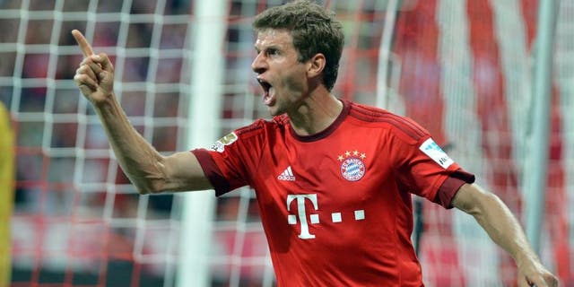 MUNICH, GERMANY - AUGUST 14: Thomas Mueller of Munich celebrates after scoring a goal during the German Bundesliga soccer match between Bayern Munich and Hamburger SV at the Allianz Arena in Munich, Germany on August 14, 2015. (Photo by Joerg Koch/Anadolu Agency/Getty Images)