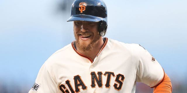 SAN FRANCISCO, CA - MAY 19: Hunter Pence #8 of the San Francisco Giants heads back to the dugout after striking out in the bottom of the second inning against the Los Angeles Dodgers at AT&T Park on May 19, 2015 in San Francisco, California. The Giants swept the NL West leaders during the last homestand in San Francisco. (Photo by Don Feria/Getty Images)
