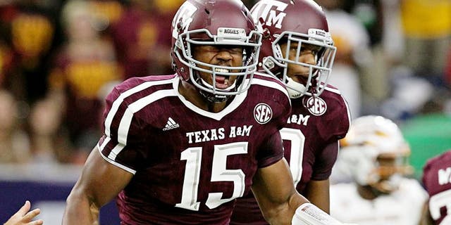 Sep 5, 2015; Houston, TX, USA; Texas A&M Aggies defensive lineman Myles Garrett (15) celebrates his sack against Arizona State Sun Devils quarterback Mike Bercovici (2) (not pictured)in the first quarter at NRG Stadium. Mandatory Credit: Thomas B. Shea-USA TODAY Sports