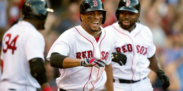BOSTON, MA - SEPTEMBER 5: Xander Bogaerts #2 of the Boston Red Sox reacts after hitting a bases clearing triple and then scoring on a throwing error during the fourth inning against the Philadelphia Phillies at Fenway Park on September 5, 2015 in Boston, Massachusetts. (Photo by Michael Ivins/Boston Red Sox/Getty Images)