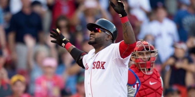 BOSTON, MA - SEPTEMBER 5: David Ortiz #34 of the Boston Red Sox reacts after hitting a home run during the fourth inning against the Philadelphia Phillies at Fenway Park on September 5, 2015 in Boston, Massachusetts. It was career home run number 496 for Ortiz. (Photo by Michael Ivins/Boston Red Sox/Getty Images)