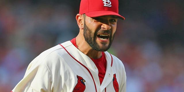ST. LOUIS, MO - SEPTEMBER 5: Starter Jaime Garcia #54 of the St. Louis Cardinals celebrates after getting out of the in the seventh inning without allowing the Pittsburgh Pirates to score a run at Busch Stadium on September 5, 2015 in St. Louis, Missouri. (Photo by Dilip Vishwanat/Getty Images)