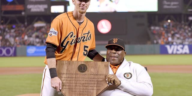 SAN FRANCISCO, CA - OCTOBER 02: Matt Duffy #5 of the San Francisco Giants, this year's recepient of the Willie Mac Award, stands with the former Giants great Willie McCovey prior to the game against the Colorado Rockies at AT&T Park on October 2, 2015 in San Francisco, California. (Photo by Thearon W. Henderson/Getty Images)