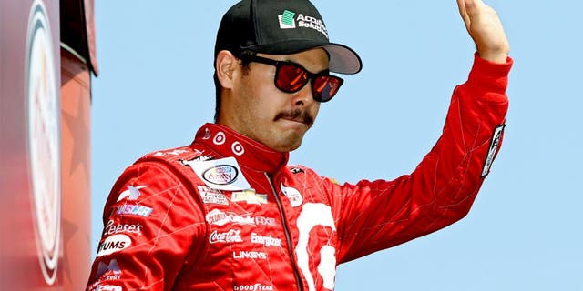 DARLINGTON, SC - SEPTEMBER 05: Kyle Larson, driver of the #42 AccuDoc Solutions Chevrolet, takes part in pre-race ceremonies for the NASCAR XFINITY Series VFW Sport Clips Help A Hero 200 at Darlington Raceway on September 5, 2015 in Darlington, South Carolina. (Photo by Kena Krutsinger/Getty Images)