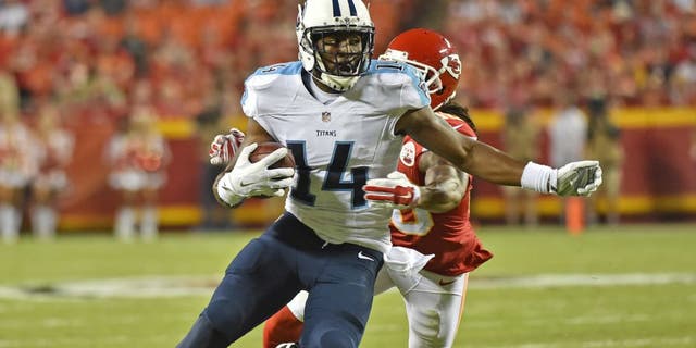 KANSAS CITY, MO - AUGUST 28: Wide receiver Hakeem Nicks #14 of the Tennessee Titans runs up field against defensive back Jamell Fleming #30 of the Kansas City Chiefs during the first half of a preseason game at Arrowhead Stadium on August 28, 2015 in Kansas City, Missouri. (Photo by Peter G. Aiken/Getty Images)