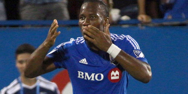 Sep 5, 2015; Montreal, Quebec, CAN; Montreal Impact forward Didier Drogba (11) celebrates his goal against Chicago Fire during the first half at the Sade Saputo. Mandatory Credit: Jean-Yves Ahern-USA TODAY Sports