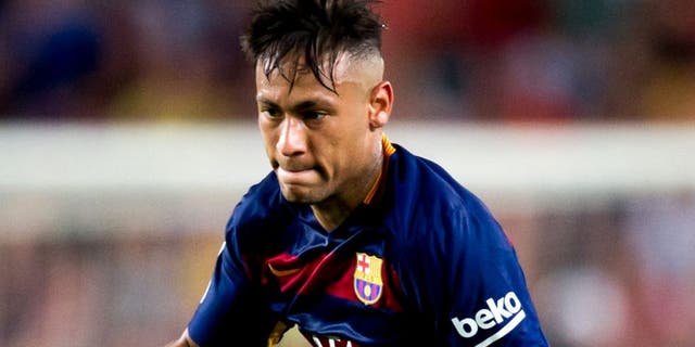 BARCELONA, SPAIN - AUGUST 29: Neymar Santos Jr of FC Barcelona runs with the ball during the La Liga match between FC Barcelona and Malaga CF at Camp Nou on August 29, 2015 in Barcelona, Spain. (Photo by Alex Caparros/Getty Images)