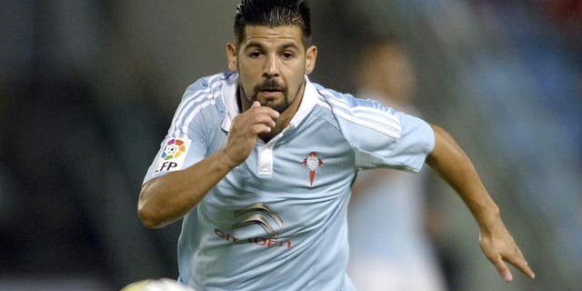 Celta Vigo's forward Nolito chases the ball during the Spanish league football match Celta Vigo vs Getafe CF at the Balaidos stadium in Vigo on October 2, 2015. AFP PHOTO / MIGUEL RIOPA (Photo credit should read MIGUEL RIOPA/AFP/Getty Images)