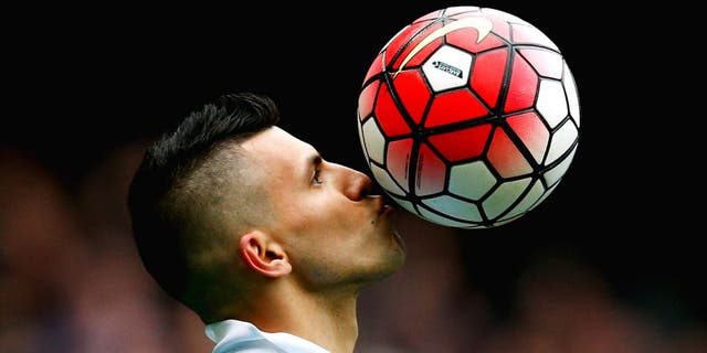 MANCHESTER, ENGLAND - OCTOBER 03: Sergio Aguero of Manchester City kisses the ball to celebrate a goal and his hat-trick during the Barclays Premier League match between Manchester City and Newcastle United at Etihad Stadium on October 3, 2015 in Manchester, United Kingdom. (Photo by Dean Mouhtaropoulos/Getty Images)